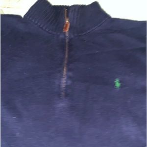 Blue zip up polo sweater with a green polo sign